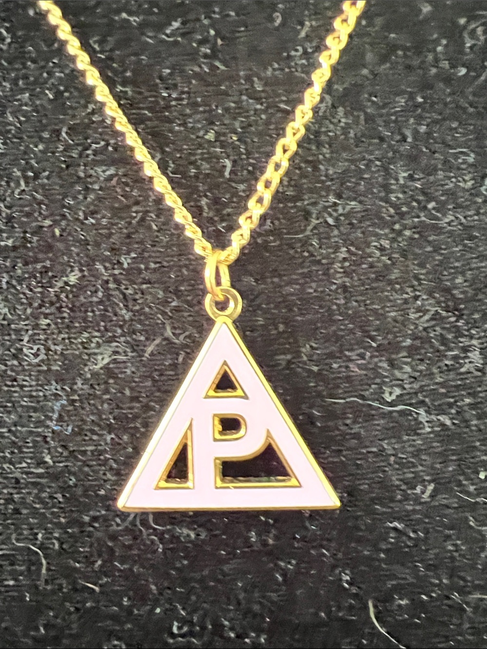 Hot Topic Poppy Triangle Necklace w Gold Chain. 19” chain; 1” pendant